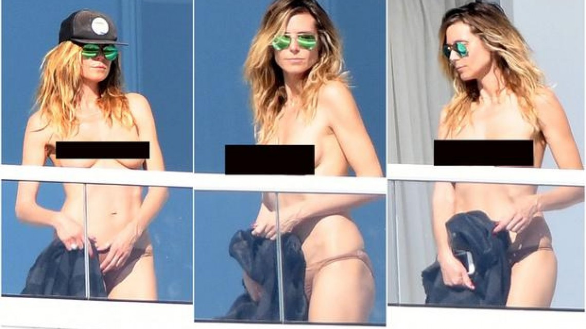 Heidi Klum se asolea en "topless"