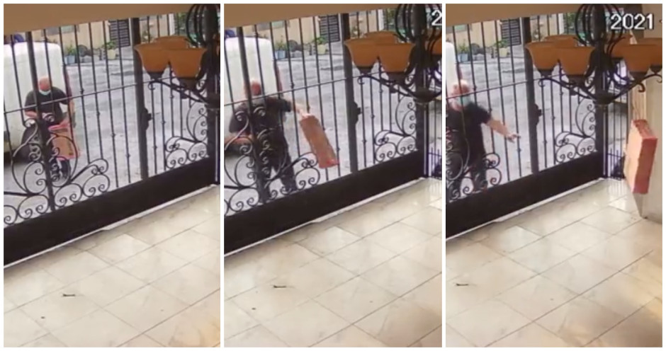 Repartidor lanza una laptop a través de una reja