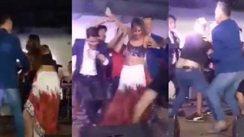Mujer besa a cantante y su marido se enojó ¡y casi lo golpea!